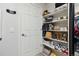 Organized closet with shelves for shoes, bags, and folded items at 23376 E 5Th Pl # 201, Aurora, CO 80018