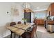 Open-concept dining area with views of the kitchen featuring modern appliances and countertops at 23376 E 5Th Pl # 201, Aurora, CO 80018