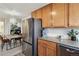 A modern kitchen seamlessly integrates with a dining area, creating a functional space with stainless appliances at 23376 E 5Th Pl # 201, Aurora, CO 80018