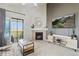 Cozy living room featuring a fireplace, balcony access, and a modern entertainment center with sleek decor at 23376 E 5Th Pl # 201, Aurora, CO 80018