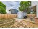 Grassy backyard with garden shed, patio and wooden privacy fence at 12556 Elm St, Thornton, CO 80241