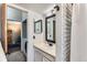 Stylish bathroom with white subway tile shower, vanity and modern fixtures at 12556 Elm St, Thornton, CO 80241