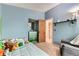 Light-filled bedroom with carpet, a closet, and comfortable furniture at 12556 Elm St, Thornton, CO 80241