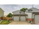 Charming townhouse with two-car garage, red brick accents and lush green lawn at 12556 Elm St, Thornton, CO 80241