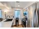 Modern kitchen features stainless steel appliances, quartz countertops and ample lighting at 12556 Elm St, Thornton, CO 80241