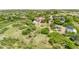 An aerial view of the property and surrounding neighborhood with rolling hills in the distance at 9053 Clydesdale Rd, Castle Rock, CO 80108