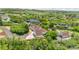 Stunning aerial view of a home and surrounding landscape with mature trees and a long driveway at 9053 Clydesdale Rd, Castle Rock, CO 80108