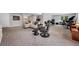 Finished basement with entertainment area, carpeting, lighting and neutral color palette at 9053 Clydesdale Rd, Castle Rock, CO 80108