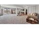Spacious finished basement with sliding glass door to patio and recreational area at 9053 Clydesdale Rd, Castle Rock, CO 80108