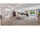 Finished basement with multiple activity spaces with carpeting, lighting and neutral color palette at 9053 Clydesdale Rd, Castle Rock, CO 80108