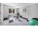 Finished basement with workout area, window and neutral color palette at 9053 Clydesdale Rd, Castle Rock, CO 80108