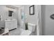 Updated bathroom with white marble floors, white vanity, and a shower at 9053 Clydesdale Rd, Castle Rock, CO 80108