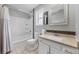Bright bathroom featuring a shower/tub combo, vanity with granite countertops, and neutral color palette at 9053 Clydesdale Rd, Castle Rock, CO 80108