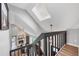 Inviting foyer with fireplace, skylight and open to the living and dining spaces at 9053 Clydesdale Rd, Castle Rock, CO 80108