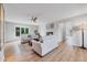 Bright living room with hardwood floors, fireplace, and an abundance of natural light at 9053 Clydesdale Rd, Castle Rock, CO 80108