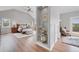 A view of main bedroom with wood floors and connecting room with a seating area at 9053 Clydesdale Rd, Castle Rock, CO 80108