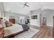 Spacious main bedroom with vaulted ceilings, fireplace, and access to an outdoor balcony at 9053 Clydesdale Rd, Castle Rock, CO 80108