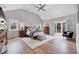 Bright main bedroom boasts vaulted ceilings and private balcony access for relaxing outdoors at 9053 Clydesdale Rd, Castle Rock, CO 80108