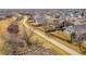 Aerial view of a home with a spacious backyard, walking path and neighborhood at 13124 Ivy Pl, Thornton, CO 80602