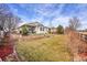 Large, well-maintained backyard with a covered patio and established landscaping at 13124 Ivy Pl, Thornton, CO 80602