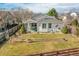 Aerial view of the backyard featuring a well-kept lawn, patio, and landscaping at 13124 Ivy Pl, Thornton, CO 80602