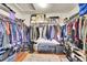 Walk-in closet with lots of storage with shelving and hanging rods, great for staying organized at 13124 Ivy Pl, Thornton, CO 80602