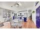 Stylish kitchen with an island adjacent to a dining area, all illuminated by natural light at 13124 Ivy Pl, Thornton, CO 80602