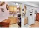 Efficient kitchenette with light wood cabinets, stainless microwave and a view to the fridge at 13124 Ivy Pl, Thornton, CO 80602