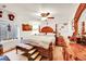 Spacious primary bedroom with a decorative headboard and an abundance of natural light at 13124 Ivy Pl, Thornton, CO 80602