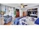 Spacious main bedroom with hardwood floors, ample closet space, and a cozy chair, perfect for relaxation at 13124 Ivy Pl, Thornton, CO 80602