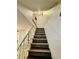 Staircase featuring wood steps, neutral walls, and a modern railing at 1652 S Idalia Cir # C, Aurora, CO 80017