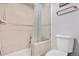 Bathroom with shower/tub combo and frosted glass enclosure at 961 S Evanston Cir, Aurora, CO 80012