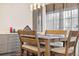 Dining area with gray cabinets and wood table at 961 S Evanston Cir, Aurora, CO 80012