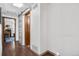 Clean hallway with wooden floors and barn door at 961 S Evanston Cir, Aurora, CO 80012