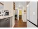 Kitchen with gray cabinets, white countertops, and a view into the hallway at 961 S Evanston Cir, Aurora, CO 80012