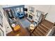 Upstairs view of living room, showing hardwood floors and fireplace at 961 S Evanston Cir, Aurora, CO 80012