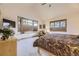 Inviting bedroom featuring a bay window, comfortable furniture, and ample natural light, creating a serene atmosphere at 8576 Niwot Meadow Farm Rd, Niwot, CO 80503
