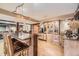 Open dining space with a large island and custom wooden cabinets at 8576 Niwot Meadow Farm Rd, Niwot, CO 80503