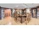 Unique dining area featuring stone walls, a rustic bar, and wooden floors at 8576 Niwot Meadow Farm Rd, Niwot, CO 80503