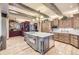 Open concept kitchen features stone accents, a large island, and stainless steel appliances at 8576 Niwot Meadow Farm Rd, Niwot, CO 80503