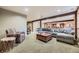 Cozy living room featuring a comfortable sectional sofa and wood beam accents at 8576 Niwot Meadow Farm Rd, Niwot, CO 80503