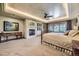 Spacious main bedroom featuring a fireplace, sitting area, decorative ceiling, and an abundance of natural light at 8576 Niwot Meadow Farm Rd, Niwot, CO 80503