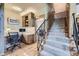 Functional home office with custom built-ins and desk space, adjacent to a staircase leading to another level at 8576 Niwot Meadow Farm Rd, Niwot, CO 80503