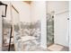 Spa-like bathroom with soaking tub, tiled walls, and glass shower at 175 S Jasmine St, Denver, CO 80224