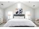 Bright bedroom with vaulted ceilings, modern art, and neutral decor at 175 S Jasmine St, Denver, CO 80224