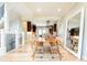 Elegant dining room with hardwood floors, modern chairs, and a large mirror at 175 S Jasmine St, Denver, CO 80224