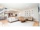 Bright living room with large sectional couch, stylish coffee table, and a gallery wall at 175 S Jasmine St, Denver, CO 80224