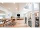 Spacious, open-concept dining and living area with hardwood floors and white staircase with metal railings at 175 S Jasmine St, Denver, CO 80224