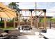 Inviting patio with pergola, outdoor seating, and privacy fence at 175 S Jasmine St, Denver, CO 80224