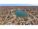 Panoramic aerial view showing residential area surrounding tranquil lake, blending nature with community living at 4760 W Evans Ave, Denver, CO 80219